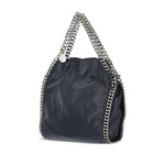 Stella McCartney Falabella mini handbag in blue black with chain-link handles and trim, featuring an internal slip pocket and concealed magnetic fastening.