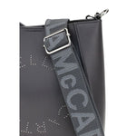 Close-up of Stella McCartney Logo Shoulder Bag featuring logo detail and adjustable strap with topstitching on sustainable material.