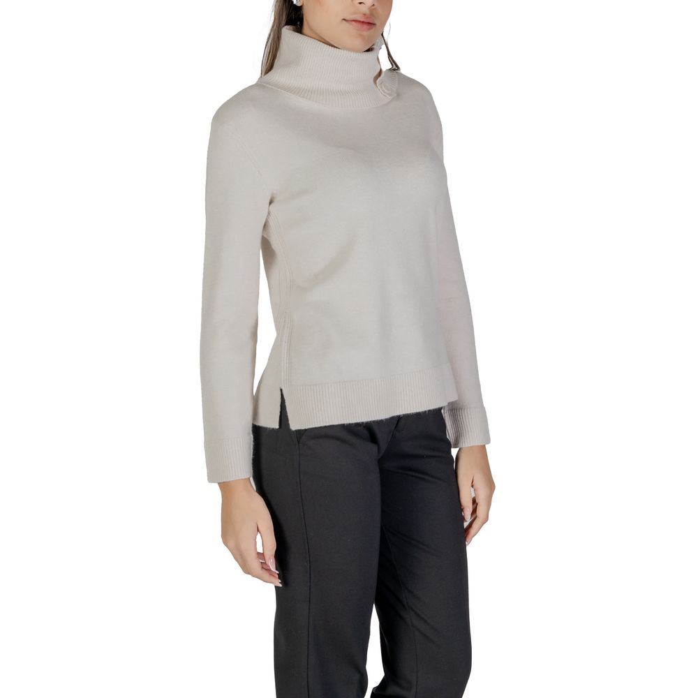 Woman wearing Street One Cream Viscose Turtleneck with side buttons and long sleeves.