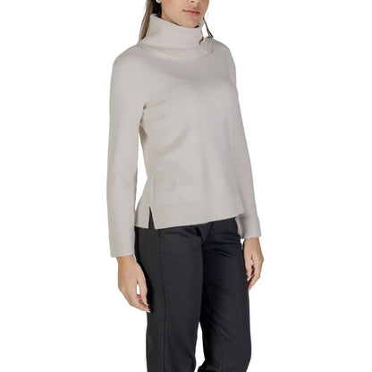 Woman wearing Street One Cream Viscose Turtleneck with side buttons and long sleeves.