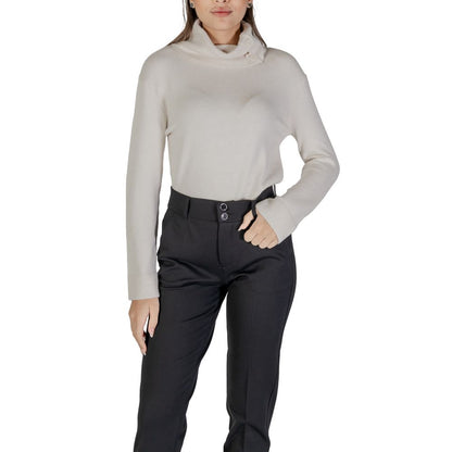 Woman wearing Street One Cream Viscose Turtleneck with side buttons, long sleeves, and high neck.