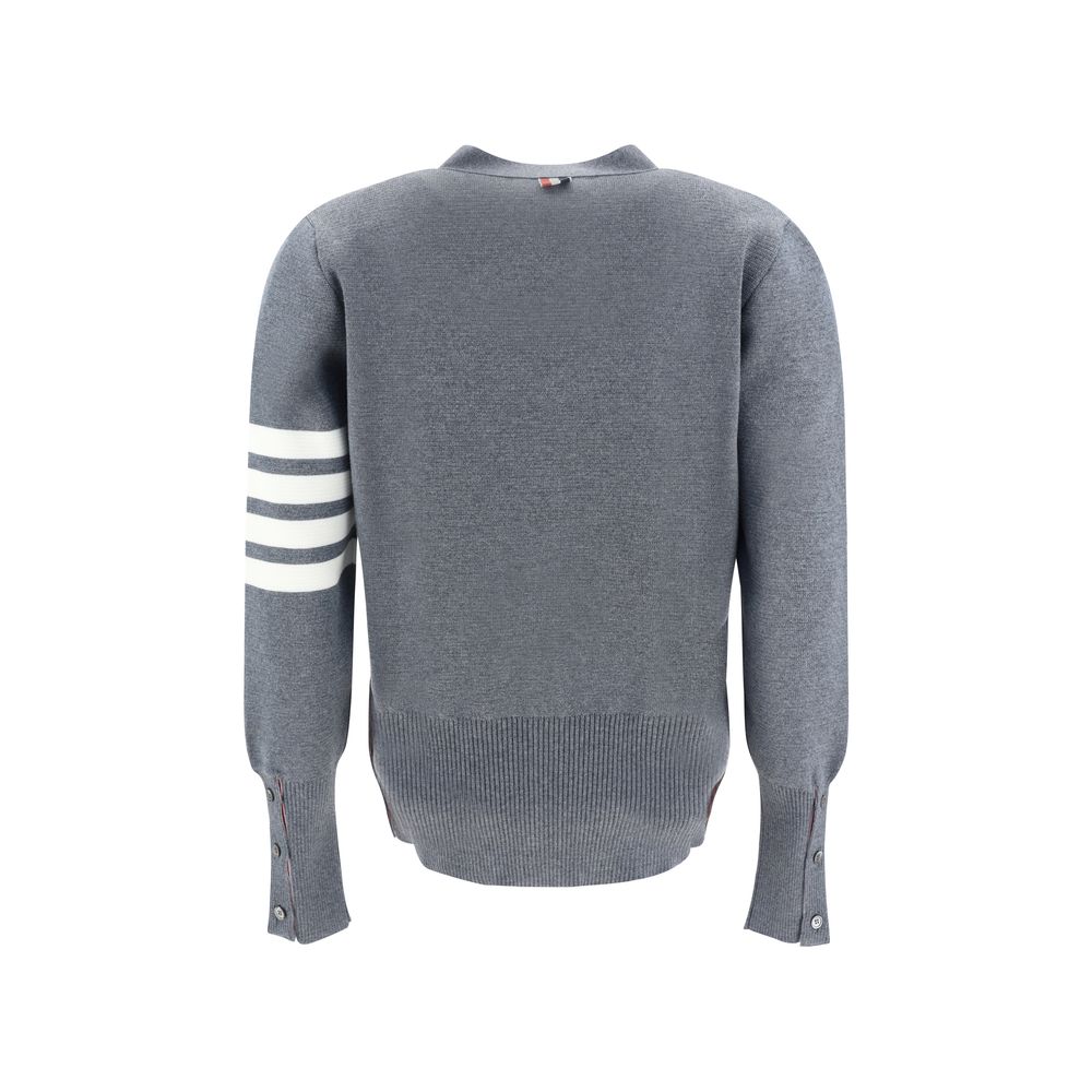 Back view of Thom Browne Cardigan with iconic logo bands and striped cuffs, made from fleece wool, showcasing AW25 design.