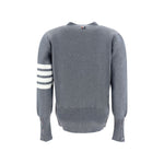 Back view of Thom Browne Cardigan with iconic logo bands and striped cuffs, made from fleece wool, showcasing AW25 design.