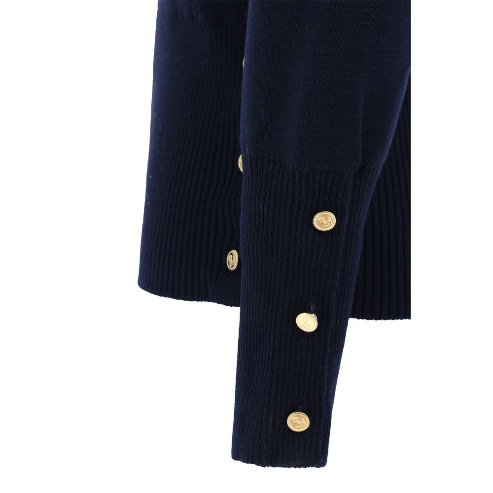 Detail of Thom Browne Virgin wool Sweater with ribbed cuff and gold buttons.