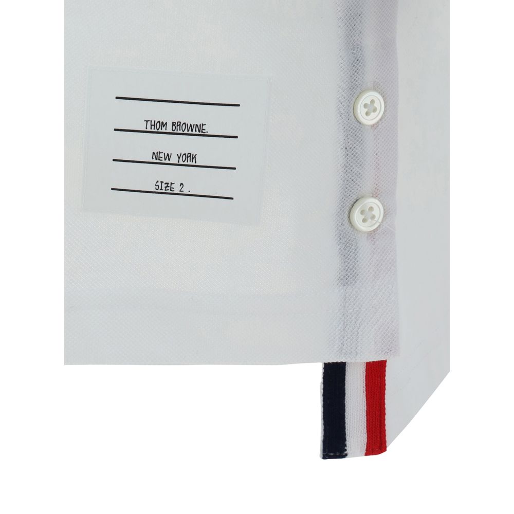 Close-up of Thom Browne White Cotton Polo Shirt label with buttons and signature contrasting bands.