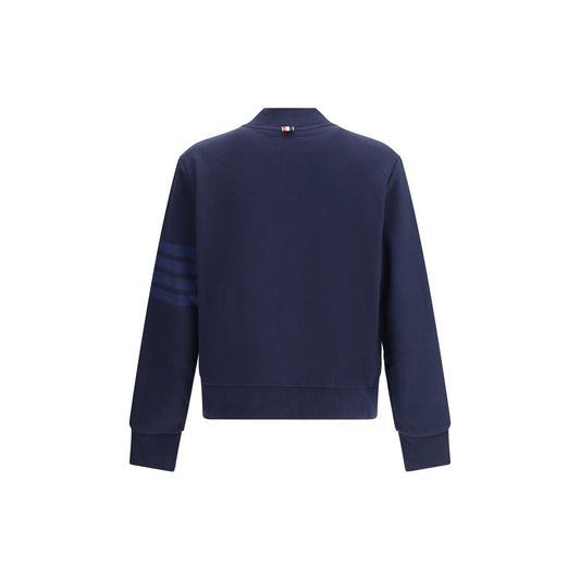 Back view of Thom Browne Zip Sweatshirt with signature bands on sleeve, ribbed cuffs, and hem, made of 100% cotton in navy blue.