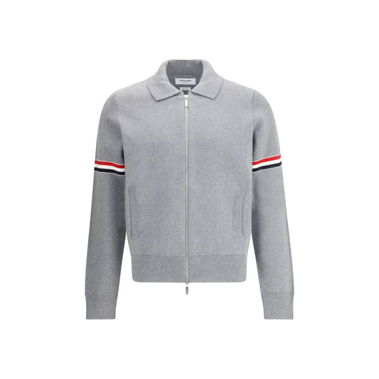 Thom Browne Zip Sweatshirt with front zipper, ribbed cuffs, and iconic stripes on sleeve; 100% cotton, made in Japan.