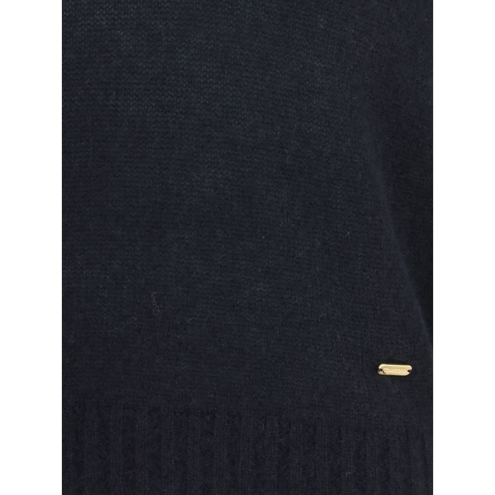 Close-up of Tom Ford Black Cashmere Cashmere Sweater with ribbed hem and subtle gold detail for a sophisticated look.