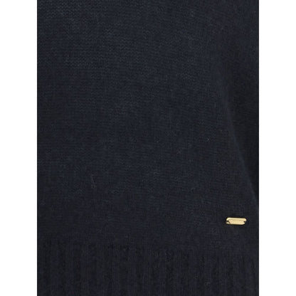 Close-up of Tom Ford Black Cashmere Cashmere Sweater with ribbed hem and subtle gold detail for a sophisticated look.