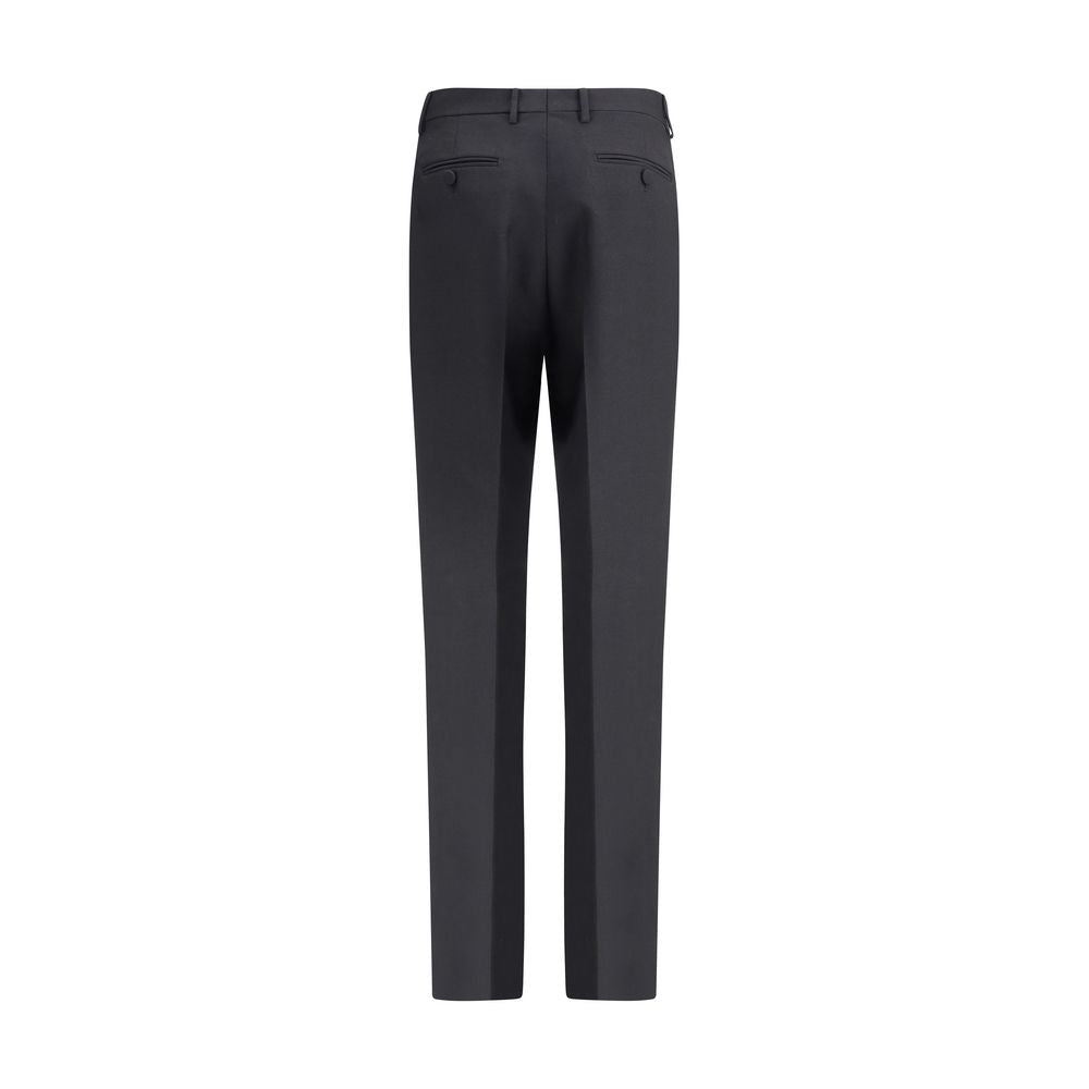 Back view of Tom Ford Black Wool Pants with high waist, belt loops, and a center pleat, crafted from wool gabardine and silk.