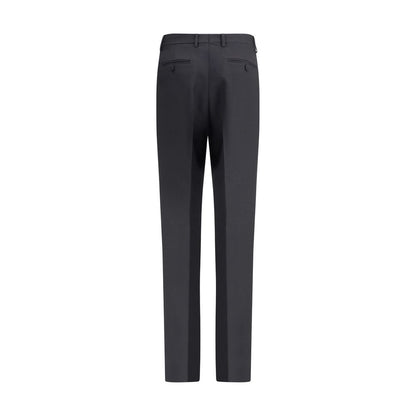 Back view of Tom Ford Black Wool Pants with high waist, belt loops, and a center pleat, crafted from wool gabardine and silk.