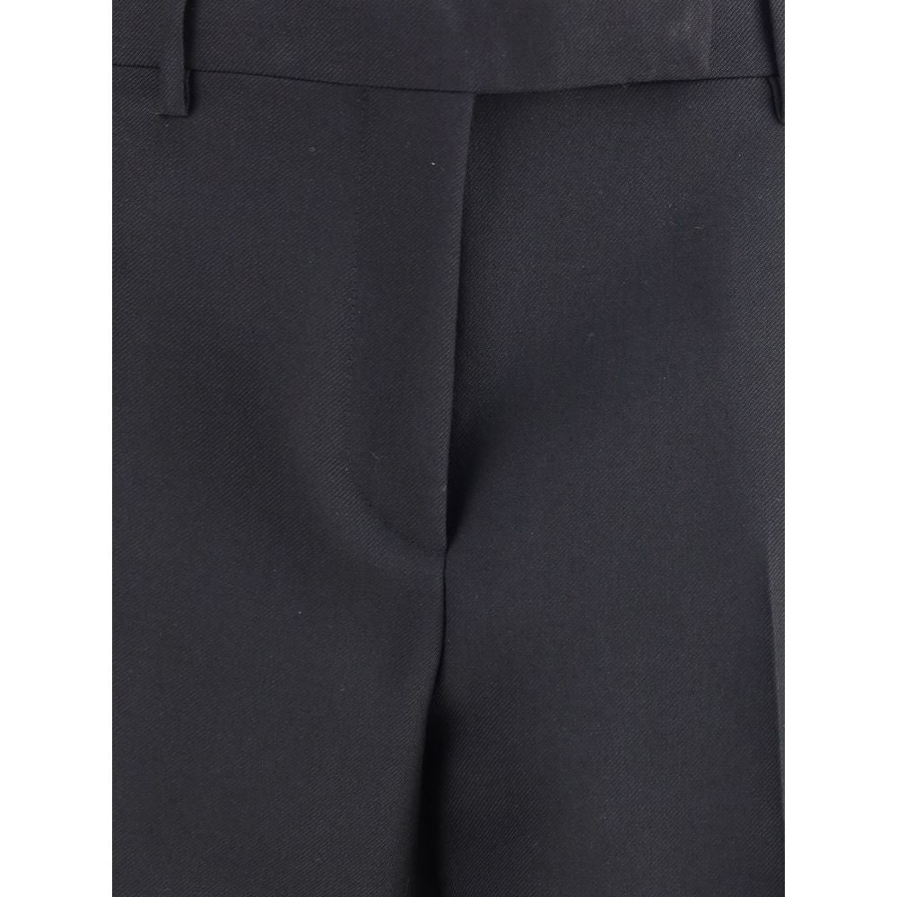 Close-up of Tom Ford Black Wool Pants featuring fine wool gabardine, high waist, and elegant fit suitable for AW25.