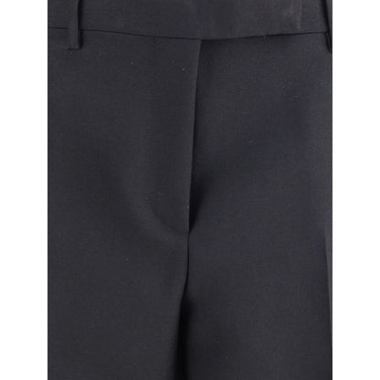 Close-up of Tom Ford Black Wool Pants featuring fine wool gabardine, high waist, and elegant fit suitable for AW25.