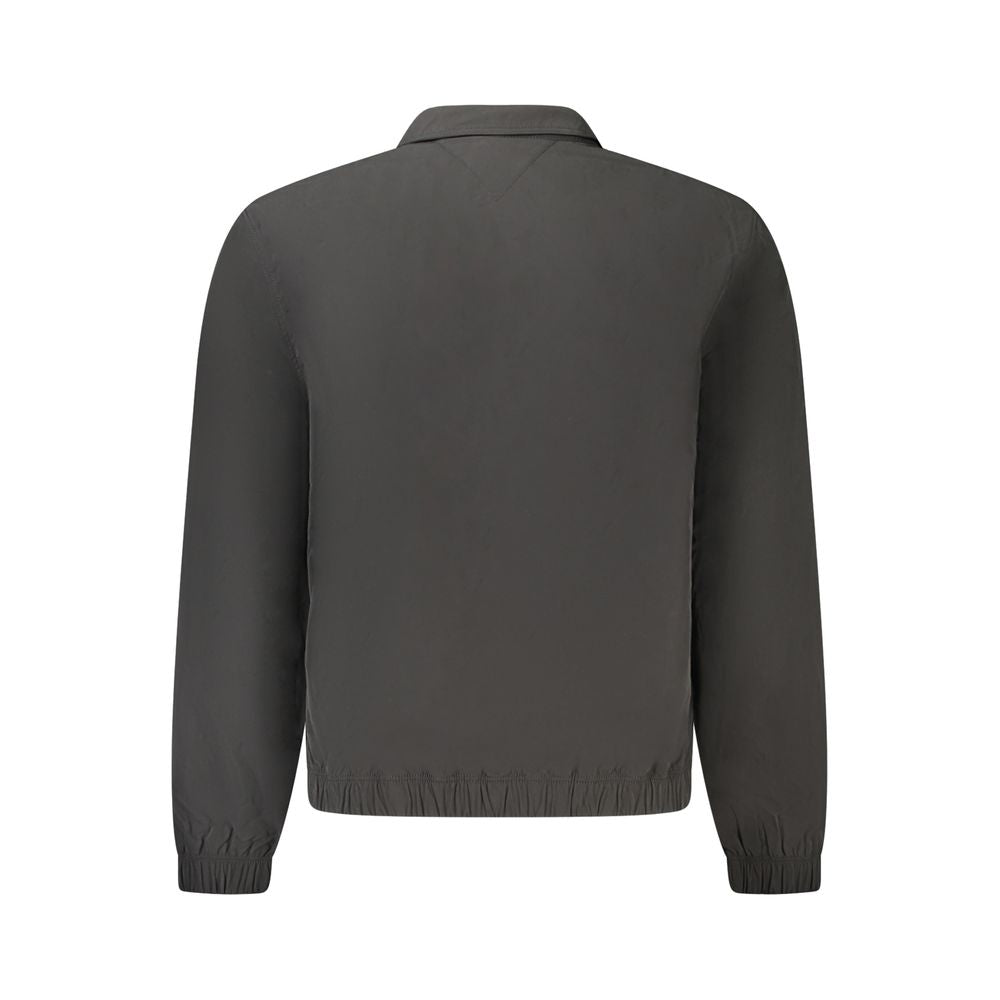 Back view of Tommy Hilfiger Black Polyester Men Jacket with long sleeves and iconic logo detailing.