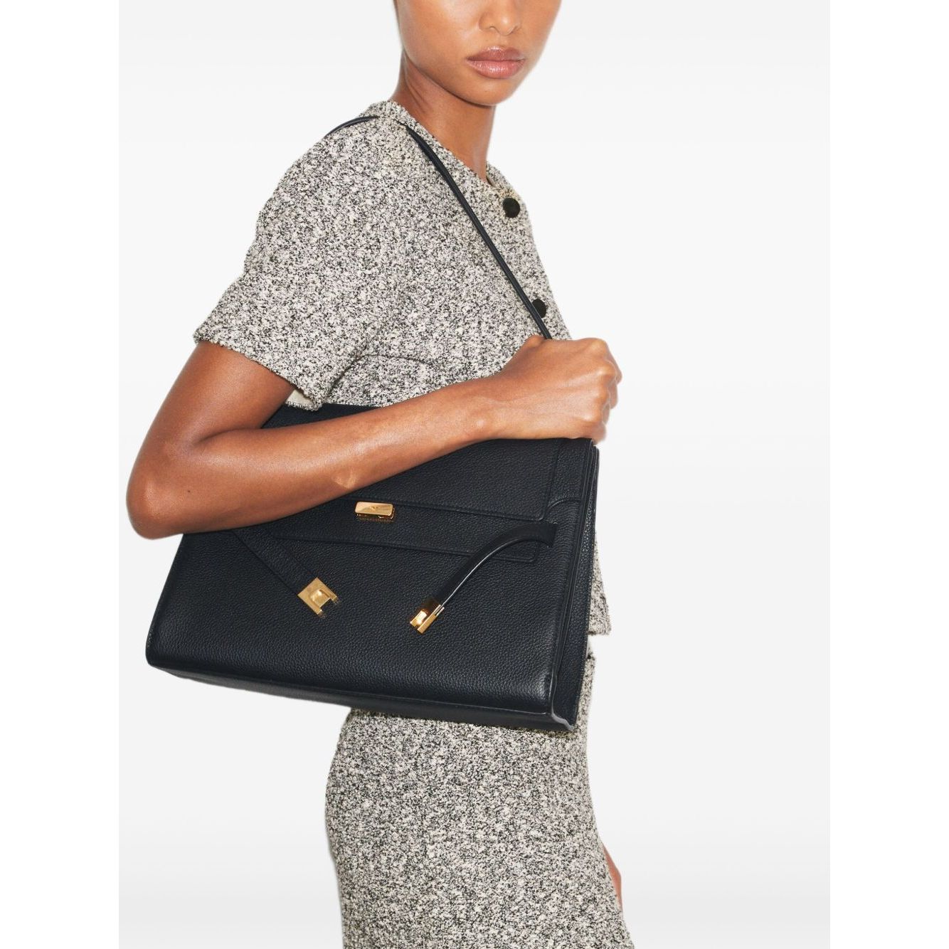 Tory Burch Lee Radziwill large leather handbag in black pebble leather with gold-tone hardware and shoulder strap