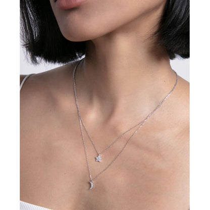 Woman wearing silver necklace, VICEROY JEWELS Mod. 13203C000-30, featuring star and moon charms, elegant design for ladies.