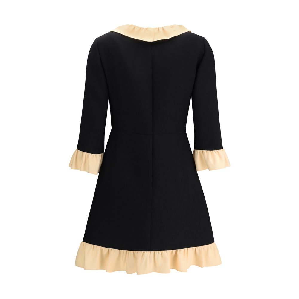 Valentino Black Fleece Wool Cocktail Dress with ruffled collar and hem, three-quarter sleeves, back view.