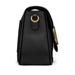 Side view of Valentino Garavani Alltime Grainy Calfskin Shoulder Bag in black with gold-tone details, showcasing detachable strap and handle.