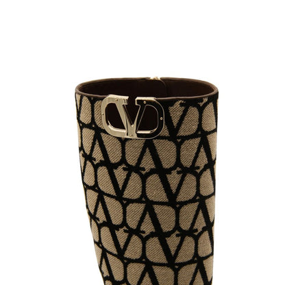 Valentino Garavani Beige Canvas Boots with Vlogo detail and side zip closure, made of 100% canvas with leather sole, 2 cm heel.