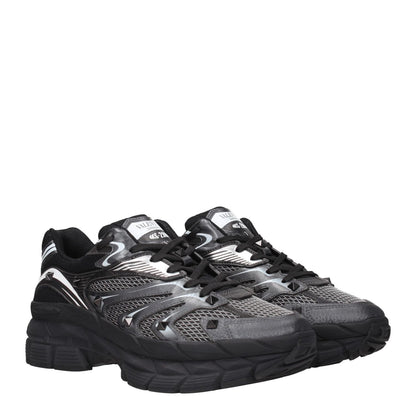 Valentino Garavani Black Fabric Athletic Sneakers with studs, front and back logo, featuring lace-up closure and mid heels.