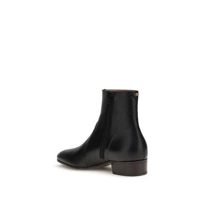 Elegant Valentino Garavani Black Goatskin Ankle Boots with brass VLogo, showcasing fine craftsmanship and sophistication.