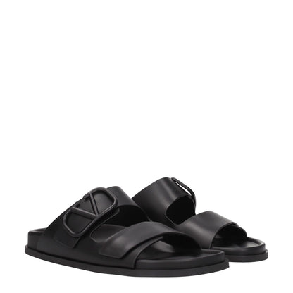 Valentino Garavani Black Leather Slippers with front logo, casual style, open toe, and rubber sole. MPN: S0G80UHE0NO.