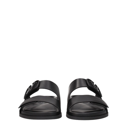 Valentino Garavani Black Leather Slippers with front logo, open toe, and rubber sole. Casual style footwear for men.