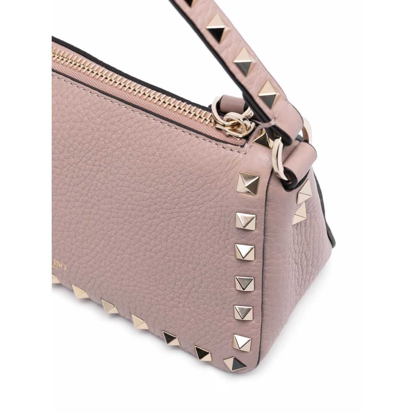 Valentino Garavani Rockstud small leather shoulder bag in powder pink with signature Rockstuds and pebbled texture, side view close-up.