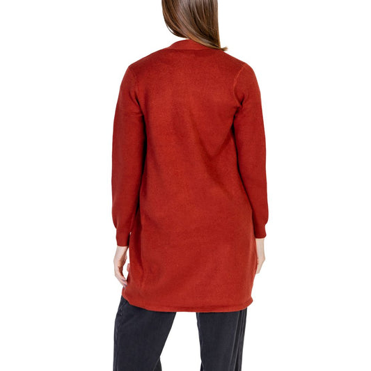 Back view of a woman wearing a Vero Moda Red Viscose Cardigan from the Fall/Winter collection, featuring a blend of viscose, polyester, and nylon.