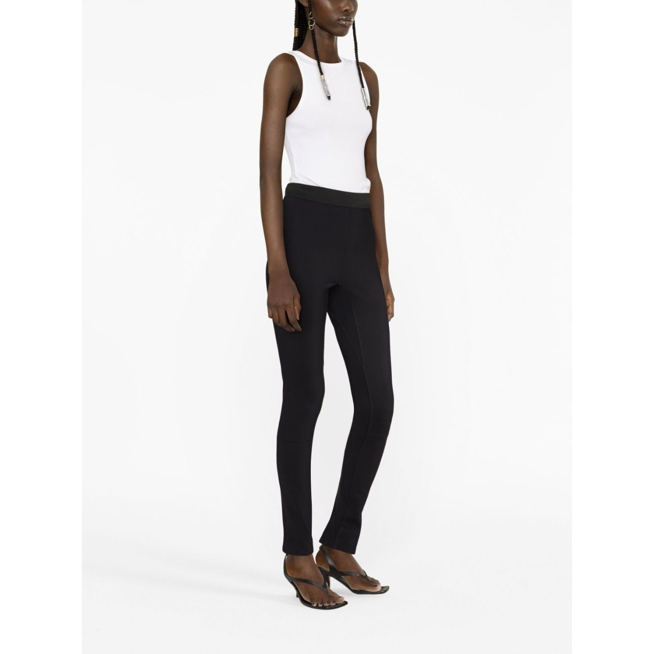 Model wearing WARDROBE.NYC Trousers Black with elasticated waist and rear slit, high waist stretch-design leggings.