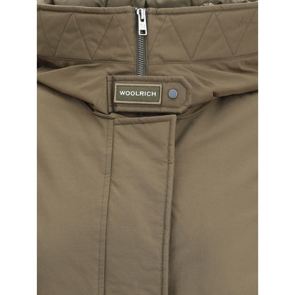 Close-up of Woolrich Green Cotton Parka showcasing zipper and quilted hood details.