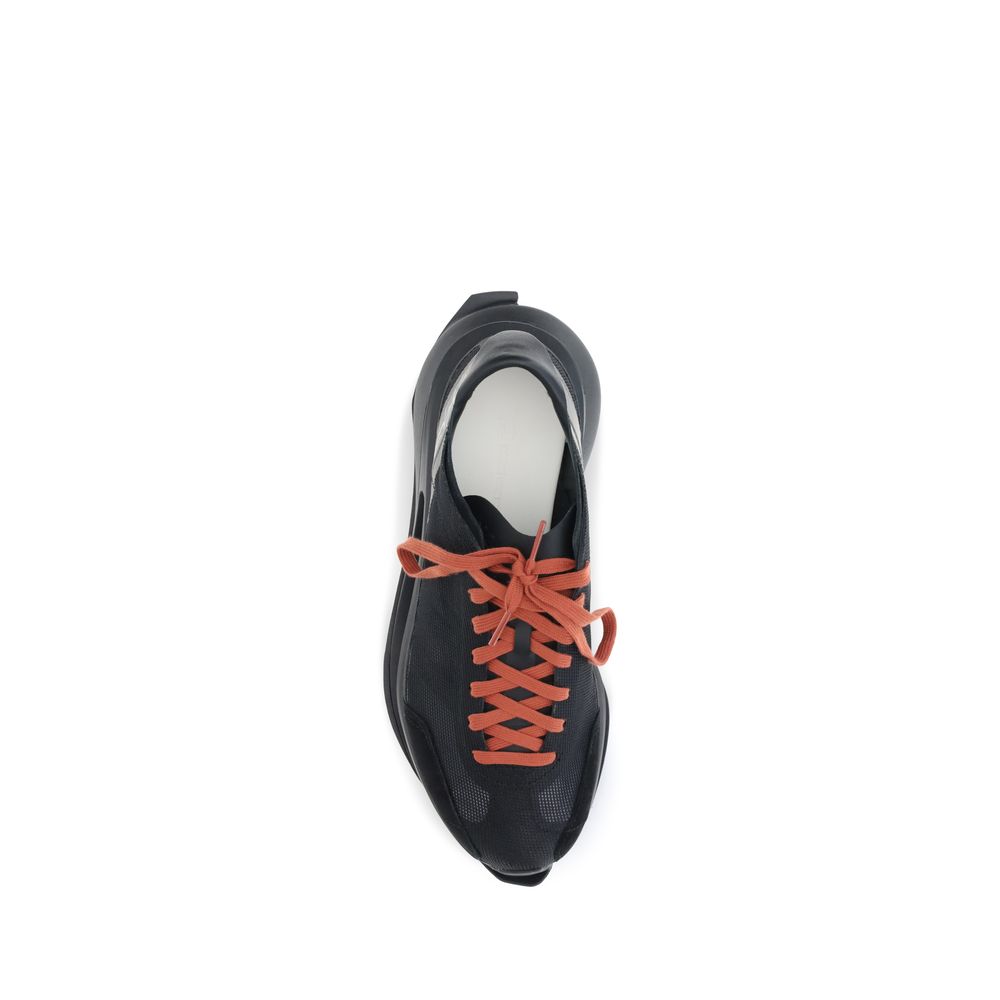Top view of Y-3 Black Leather Athletic Sneakers with orange laces, featuring innovative design and cutting-edge sole technology.