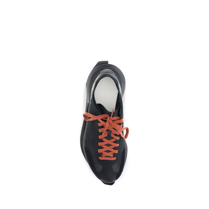 Top view of Y-3 Black Leather Athletic Sneakers with orange laces, featuring innovative design and cutting-edge sole technology.