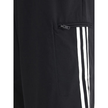 Close-up of Y-3 Black Wool Casual Pants with zipper pocket and white stripes.