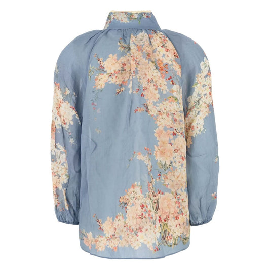 Zimmermann Cascadian Billow Blouse in light blue floral print with mock neck and long sleeves, back view showing gathered details